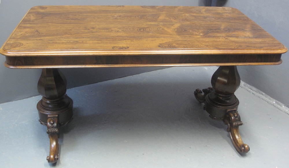 EARLY VICTORIAN ROSEWOOD RECTANGULAR LIBRARY TABLE having moulded edge top above waisted baluster