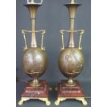 PAIR OF FRENCH PATINATED AND GILDED BRONZE TABLE LAMPS of egg shaped baluster form with relief