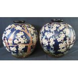 PAIR OF JAPANESE STYLE GLOBULAR BLUE GROUND VASES with short necks,