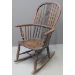 19TH CENTURY ASH AND ELM WINDSOR SPLAT BACKED ROCKING CHAIR with moulded seat on baluster turned