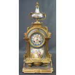 19TH CENTURY ORMOLU PORCELAIN MOUNTED TWO TRAIN MANTEL CLOCK the case with urn shaped porcelain