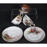 EARLY 20TH CENTURY ROYAL WORCESTER GILDED BONE CHINA CABINET CUP AND SAUCER enamelled in colours