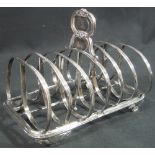 GEORGIAN SILVER TOAST RACK having foliate loop handle with armorials and initials,