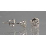 PAIR OF 14CT WHITE GOLD DIAMOND STUD EARRINGS. The brilliant cut diamonds an estimated 0.