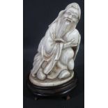 CARVED IVORY FIGURE OF SHOU - LAO, holding the peach of longevity,