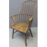 19TH CENTURY ASH AND ELM PRIMITIVE STICK BACKED ELBOW CHAIR having moulded seat on turned legs.