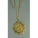 AN EDWARD VII 1903 GOLD SOVEREIGN set in a 9ct gold pendant mount decorated with hearts on a 9ct