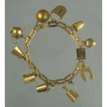 UNMARKED YELLOW GOLD CHARM BRACELET.