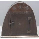 17TH CENTURY DOME TOPPED CUPBOARD with lozenge carved decoration to door and arch on moulded base.