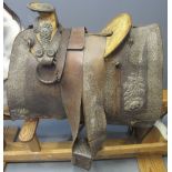 FINELY WORKED LEATHER AND METAL MOUNTED EQUESTRIAN SADDLE with shaped wooden seat and pommel metal