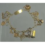 A 9CT GOLD CHARM BRACELET with fifteen 9ct and yellow metal charms, including a bear, crescent moon,