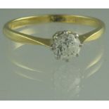 AN 18CT GOLD DIAMOND SOLITAIRE RING. The old cut diamond an estimated 0.5cts, Ring size P. Weight 2.