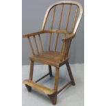 19TH CENTURY ELM AND ASH STICK BACKED CHILD'S CHAIR with wrap round arms, solid seat and foot board.