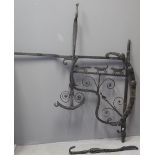 UNUSUAL WROUGHT IRON RANGE SIDE KETTLE ENGINE the adjustable mechanism decorated with hounds