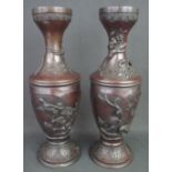 PAIR OF MEIJI PERIOD JAPANESE BRONZE VASES overall with reserve relief panels depicting birds