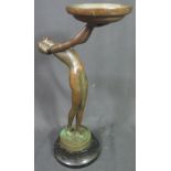 BRONZE STUDY OF A SEMI-NUDE LADY with her back arched holding a large dish,