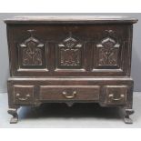 18TH CENTURY WELSH OAK COFFER BACH having loose moulded edge top above three panel front,