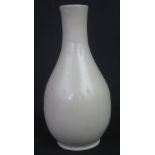 CHINESE STONEWARE SMALL BOTTLE VASE, possibly Song whiteware. 17cm high approx. (B.P. 24% incl.