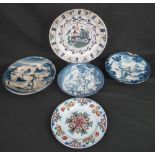 A COLLECTION OF FOUR 18TH CENTURY DELFT TIN GLAZED PLATES or shallow bowls,