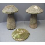 TWO SIMILAR RECONSTITUTED STONE STADDLE STONES together with one additional top. (5 items) (B.P.