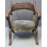 19TH CENTURY CARVED OAK FOLDING SAVONAROLA STYLE CHAIR having foliate moulded panels,