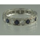 AN 18CT WHITE GOLD SAPPHIRE AND DIAMOND HALF ETERNITY STYLE RING of five sapphires and five