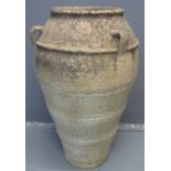 LARGE TERRACOTTA AMPHORA SHAPED GARDEN URN with three loop handles and relief bands.