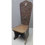 19TH CENTURY CARVED OAK GOTHIC DESIGN SPINNING CHAIR having tracery and flower head moulded