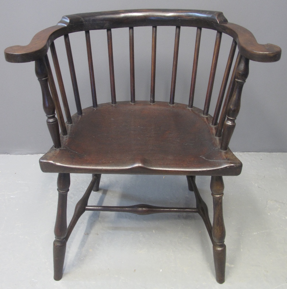 19TH CENTURY AMERICAN STICK BACKED ELBOW CHAIR in stained mixed woods with scrolled arms and