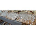 Three trays of cut glass drinking vessels, including Edinburgh crystal,