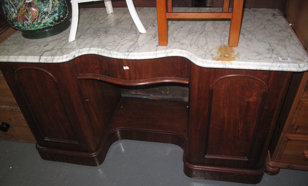 Victorian mahogany serpentine washstand with white veined marble top. (B.P. 24% incl.