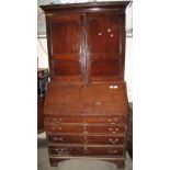 Early 19th Century Welsh oak two stage blind panelled bureau bookcase. Water damage, no reserve. (B.