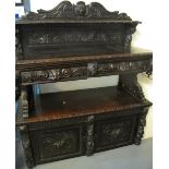 Victorian stained oak carved Flemish design buffet with mask mounts and deeply carved panels,