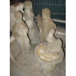 Three composite garden figurines of females, one semi-nude, together with a pedestal bird feeder.
