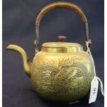 Japanese brass tea kettle with cane work handle and engraved dragon decoration. (B.P. 24% incl.