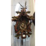 Bavarian wooden cuckoo clock stag pediment, two fir cone weights and pendulum. (B.P. 24% incl.