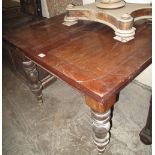 Early 20th Century mahogany draw leaf table on turned legs and casters. Water damaged, no reserve.