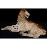 Russian (USSR) porcelain study of a reclining dog. Printed marks. (B.P. 24% incl.