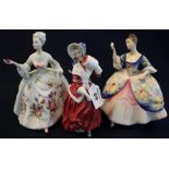 Group of three Royal Doulton bone china figurines to include; 'Christmas Morn' HN1992,