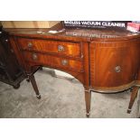 Mahogany inlaid bow front sideboard on square tapering legs and spade feet.