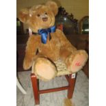 Modern Hamleys teddy bear on associate child or doll's bar back chair. (2) (B.P. 24% incl.