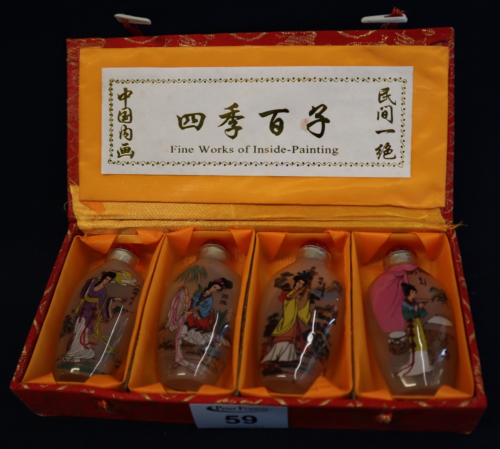 Four modern Chinese interior painted glass snuff bottles, original box. (4) (B.P. 24% incl.