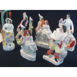 Group of six Staffordshire pottery flat back figures, various including; two similar clock groups,
