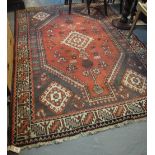 Middle Eastern design carpet on a salmon ground with geometric decoration. (B.P. 24% incl.