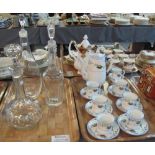 Three glass decanters with stoppers,