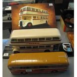 Diecast model of a double decker bus on wooden plinth,