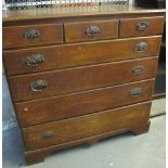 Edwardian oak straight front chest of three short and four long drawers on bracket feet. (B.P.