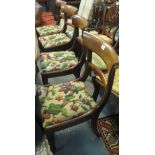 Set of four Victorian mahogany bar back dining chairs with floral stuff over seats on turned legs.