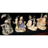 Group of four large Lladro porcelain figure groups, featuring little girls with animals and birds,