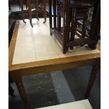 Large modern kitchen table inset with square tiles on baluster turned legs. (B.P. 24% incl.